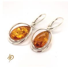 Beautiful and unique Earrings with Baltic Amber. These earrings are made of sterling silver 925 and one and only Baltic Amber from Poland. Amber in earrings all are very unique - there are small chances that You can find exactly the same earrings. Special jewels for special ladies! Amber cabochons are available in different colors (cognac, green). Amber is a very special stone and each of them could look little bit different from another - what is definitely its advantage. I tried to pick 2 the Oval Sterling Silver Earrings With Polished Finish, Elegant Pierced Amber Earrings, Handmade Elegant Baltic Amber Earrings, Hypoallergenic Amber Sterling Silver Earrings, Elegant Amber Sterling Silver Earrings, Classic Amber Sterling Silver Earrings, Amber Sterling Silver Drop Earrings, Amber Sterling Silver Earrings, Amber Sterling Silver Dangle Earrings