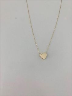 14k Solid Gold Heart Necklace, Bold Heart 14k Gold, Hollow Heart, Bold Hollow Gold Heart, Dainty Necklace, Layering Necklace, Gold Heart Necklace ------------------------------------------------------------------------------------------------ The Heart Necklace is a beautiful, affordable dainty 14K Solid Gold piece of jewelry that is great for everyday wear. It comes available just in yellow gold. This necklace can be used in combination any of our other necklaces for a layering effect. A great 14k Gold Heart Cut Necklace With Adjustable Chain, 14k Gold Necklace With Heart Charm And Cut, 14k Gold Heart Pendant Necklace With Adjustable Chain, 14k Gold Heart Charm Necklaces With Adjustable Chain, 14k Gold Heart Charm Necklace With Adjustable Chain, 14k Gold Heart Necklace With Adjustable Chain, 14k Rose Gold Heart Pendant Necklace, Valentine's Day 14k Gold Heart Cut Charm Necklaces, Rose Gold 14k Heart Pendant Necklace