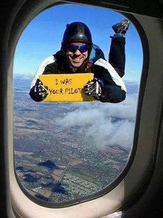 a man holding up a sign that says i was your pilot