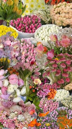 many different types of flowers are arranged together