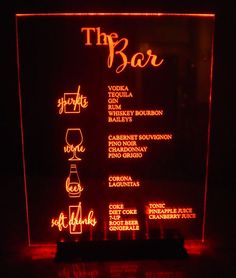 the bar illuminated sign on display in dark room