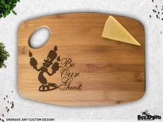 a cutting board with an image of a cat holding an umbrella and cheese on it