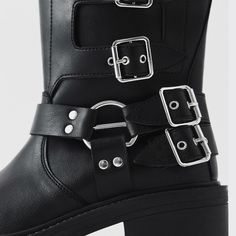 These leather boots offer a fresh take on a traditionally masculine design. They reinvent a typically masculine design and add an edgy touch with metal hardware accents. The boot's premium construction and low heel offer both support and stability, while the soft insole allows for all-day comfort. Product details: Vegan Leather lining Vegan Leather insole Block heel