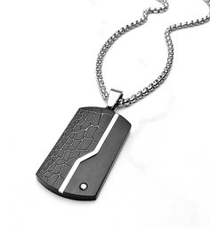 "《《  THE PENDANT COLLECTION  》》 THE DETAILS The \"BLACK METEOR TAG\" Necklace is designed with an exquisitely detailed Brushed Black Stainless Steel Dog Tag Pendant, engraved to give a Meteor like appearance, with an ultra shiny Silver stripe, and a Pavé Cubic Zirconia Stone set in the bottom corner! Hung from a Silver Stainless Steel Box Chain available in your choice of length!  The mix of meteor rock design & sleek modern esthetic create a luxurious & iconic piece of jewelry! 💠🔷️💠View our Meteor Rocks, Necklace Length Chart, Dog Tag Pendant, Black Two Piece, Engraved Stainless Steel, Jewelry Care Instructions, Rock Design, Men's Necklace, Black Ribbon