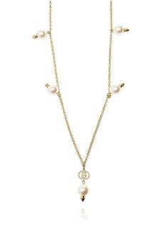 This necklase is featuring faux-pearl embellishments, an interlocking GG logoCrystal embellishmentsGold plated hardwareDelicate chainClasp fastening.Composition: Crystal, Glass, Gold Plated MetalMade in Italy Elegant Metal Necklace With Logo Charm, Elegant Metal Chain Necklace With Logo Charm, Elegant Gold-tone Chain Necklace With Logo Charm, Elegant Gold-tone Necklace With Logo Charm, Elegant Gold-tone Jewelry With Logo Charm, Elegant White Necklace With Logo Charm, Luxury Gold-tone Pearl Chain Necklace, Luxury Pearl Necklace With Metal Chain, Luxury Metal Pearl Chain Necklace