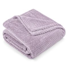 the lavender blanket is folded on top of it's back and has a white background