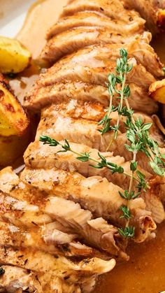 some meat and potatoes on a plate with garnishes for garnish