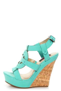 Check it out from Lulus.com! T-straps come full circle into the gorgeous Yoki Celia 12 Teal Sun Cross T-Strap Platform Wedge Sandals! Matte, minty teal vegan leather forms a stunning, open toe, T-strap upper that's entwined with a circle to form a classic sun cross shape. Quarter strap adjusts with a silver buckle (and hidden elastic). 1.25 Wedged Sandals, Mode Shoes, Heels & Wedges, Platform Wedge Sandals, Platform Wedge