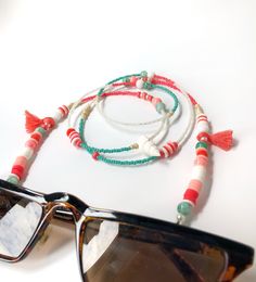 Handmade Beaded Glasses Chain,Seashell Sunglasses Strap, Eye Glass Holder,Boho Hippie Mask Chain,Summer Jewelry,Miyuki Seed Beads Lanyards If you are tired of playing hide and seek with your glasses and masks, there is a colorful news for you! Thanks to our handmade eyeglass straps, which make it almost impossible to lose glasses and give life to boring frames, you can wear your glasses comfortably by hanging them on your neck when not wearing them. It completes your full BOHO chic look! You can Trendy White Beads For Summer, Trendy White Summer Beads, Adjustable Shell Beaded Necklace With Colorful Beads, Summer Beaded Strand Chain Jewelry, Beach Season Jewelry With Beaded Chain, Handmade White Glasses Chains For Summer, Bohemian Jewelry With Large Beads For Summer, Summer Beaded Chain Jewelry, White Glasses Chains As Summer Gift