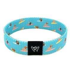 For all of us dog lovers out there, Surf Pups illustrates man's best friend catching some super chill waves. Available sizes:  Extra Small 5.5" (petites + kids) Small 6.5" (most common fitting size) Medium 7.5" (large wrists) Large or Anklet 8.5" (very large wrists or anklet) 1/2" Width Reversible surf and beachy prints. Elastic blend material, can stretch to desired fit. Packaged in natural drawstring gift pouches. Machine washable. Chlorine and saltwater safe. Coastal Bracelet, Loose Bracelet, Beachy Prints, Beach Bracelet, Beach Bracelets, Friendship Jewelry, Festival Accessories, Wristband Bracelet, Hang Loose