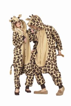 two people in giraffe onesuits standing next to each other