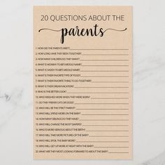 the 20 questions about the parents game is shown on a marble table with a cup of coffee