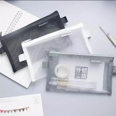 an assortment of office supplies on top of a desk