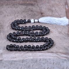 📿Karungali (black ebony wood) is a very powerful tree which our ancestors used. It was used in ancient temples and temple towers (kalasam); was also used in significant homams and other pooja rituals. Ebony Mala is here to remind us to be current and clear-headed so we can make wise and informed decisions. We are being asked to seek new ways to create beauty and harmony that are sustainable for the long-term. This is a time to bring clarity to our intentions as we focus on the future.📿 ✨ MALA Spiritual Black Beaded Necklaces With Round Beads, Black Spiritual Beaded Necklace With Round Beads, Black Spiritual Beaded Necklaces, Black Wooden Beads For Meditation, Black Spiritual Beads For Meditation, Traditional Black Mala With 108 Beads, Traditional Black Mala With 8mm Beads, Black Polished Beads Necklace For Healing, Black Spiritual Beaded Necklaces With Polished Beads