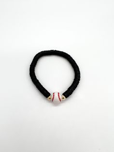 "This listing is for one baseball bracelet. You can choose the heishi bead color. We will use a default of 4mm gold filled beads on either side of the bracelet, but you may request silver if you prefer that. Show your team spirit with your team color! The standard size for the bracelets is 6.75 inches. You may request custom sizes in the personalization box. We can make bracelets for children as well, but please measure their wrists for the most accurate sizing. Please reference the chart posted Black Team Spirit Adjustable Beaded Bracelets, Black Adjustable Beaded Bracelets Team Spirit Style, Black Adjustable Beaded Bracelets For Team Spirit, Game Day Black Wristband With Letter Beads, Adjustable Team Spirit Stretch Bracelet For Game Day, Black Beaded Bracelets With Letter Beads For Game Day, Adjustable Black Team Spirit Jewelry, Adjustable Letter Beads Stretch Bracelet For Sports Events, Sporty Adjustable Beaded Bracelets For Game Day