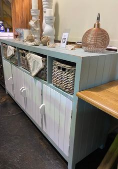 a shelf with baskets and other items on it