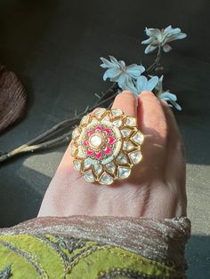 A statement ring with a beautiful and intricate design with Kundan stones. Size: Adjustable Fusion Style Wedding Ring With Intricate Design, Unique Jeweled Rings For Wedding, Jeweled Open Ring For Wedding, Wedding Jeweled Open Ring, Gift Rings With Stone Work, Elegant Stone Work Ring, Kundan Ring Jewelry For Festive Occasions, Festive Kundan Ring Jewelry, Meenakari Kundan Ring Jewelry