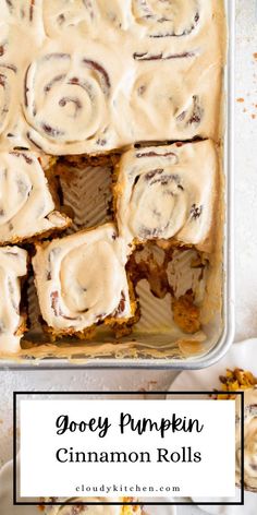 gooey pumpkin cinnamon rolls in a baking pan with the title above it reads gooey pumpkin cinnamon rolls