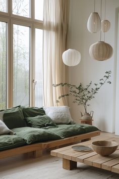 a living room filled with furniture and lots of windows