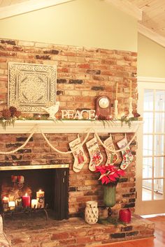 a living room with a fireplace decorated for christmas