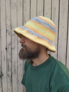 "Crochet Bucket Hat Man / Women. Unisex bucket hat made of cotton mix. These hats are so colorful that they can never be done the same 🤗 So... you will have a unique piece! They are suitable for spring and autumn weather. The yarn is soft. You can wash it in the washing machine with cold water. Size S/M fits well small heads (54-56cm / 21\"-22\") Size M/L fits well standard heads (57-59cm / 23\") Size XL fits well with a larger noggin (60-62cm / 24\") Yarn: Mix of cotton and acrylic Don't hesitate to get in touch with me for a custom order or if you need any further information. If you want a hat in a custom color, you should write the color you want in the order note or just contact me. I will send you all available variants for your choice. Thank you for visiting my shop ❤️ Polina ❤️" Knitted Bucket Hat For Festivals, Festival Knitted Bucket Hat, Yarn Bucket Hat For Summer, One Size, Crochet Bucket Hat, One Size Fits Most, Fun Crochet Bucket Hat, One Size, Bucket Hat Women, Festival Hat, Fisherman Hat, Crochet Bucket Hat