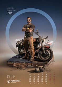 a man standing next to a motorcycle on top of a dirt covered ground in front of a calendar