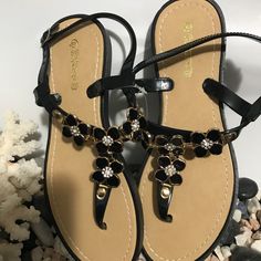 Elegant Comfortable Black Sandals Brand New. Price Is Firm Black T-strap Sandals For Summer, Black Round Toe T-strap Sandals For Summer, Trendy Black T-strap Sandals For Beach, Black Summer T-strap Sandals For Beach, Black T-strap Toe Post Sandals For Vacation, Black T-strap Sandals For Spring Vacation, Black Ankle Strap Summer Sandals, Trendy Black T-strap Sandals With Toe Post, Trendy Black T-strap Toe Post Sandals