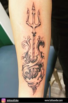 a tattoo on the leg of a woman with an anchor