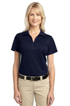 a woman wearing a blue shirt and tan pants