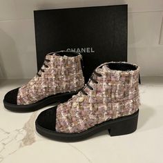 Chanel 2020 20b Collection Tweed Boots With Black Fabric Cap Toe And 1.5" Rubber Heel. 0.5" Rubber Midsole. A Double Row Of Faux Pearls At The Front. Back Zip With Goldtone Cc Logo Embellished Leather Pull. Lace Up Front. Padded Leather Insole. Rubber Sole. Made In Italy. Size: 35.5 Eu (Insole: 9", Shaft: 4" Tall). Typically Chanel Footwear Runs Small. Brand New In The Original Chanel Box. Designer Lace-up Ankle Boots For Fall, Designer Ankle Lace-up Boots For Fall, Luxury Lace-up Boots With Round Toe For Fall, Designer Flat Heel Boots For Fall, Chanel Footwear, Tweed Boots, Chanel Booties, Chanel Ankle Boots, Chanel 2020