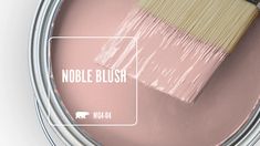 a pink paint can with a white brush in it and the words noble blush on top