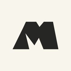 the letter m is made up of black and white letters on a light gray background