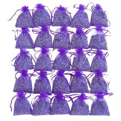 purple glitter bags filled with purple ribbons