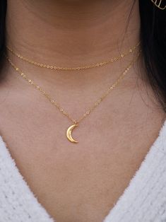 Gift this necklace to someone who needs a bit of extra glow in their world.The Moon lights up romantic evenings, pulls at the ocean tides, and represents the strength and clarity of our inner and outer worlds.Pendant measures: 14mm tall x 5mm wide. Options:1. Solid Sterling Silver .925 necklace chain and pendant.2. 14/20 Gold Filled necklace chain with 18k gold-plated pendant. WHAT LENGTH CHAIN DO I NEED?Simulate the length by draping a piece of yarn or string around your neck and bringing it to Moon Necklace Gold, Moon Lights, Crescent Moon Necklace Gold, Jewelry Giveaway, Ocean Tides, Gold Moon Necklace, Chain And Pendant, Crescent Moon Necklace, Romantic Evening