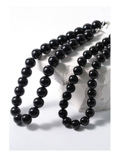 Experience the bold and versatile beauty of our 14mm Black Onyx Beaded Necklace with OT Buckle. This uniquely crafted necklace features large black onyx beads and an OT clasp, creating a statement piece that effortlessly combines boldness with contemporary style. Metal: Recycled Sterling Silver Plated On Brass Gemstone: Black onyx 14mm Length: 420mm Weight: 105g Buckle Necklace, Edison Pearls, Gemstone Beaded Necklace, Onyx Bead, Tiger Eye Stone, Recycled Sterling Silver, Brass Material, Stone Necklace, Ring Bracelet