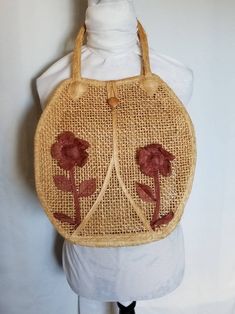 Vintage Clothing, Womens 70s Handbag, 1970s Purse, Accessories, Festival Outfit, Bohemain Fashion, Boho Style, Bag, Tote, Straw, Tan, Floral Gorgeous 1970's bohemian style top handle woven tote- perfect for carrying all the necessities on a night out on the town, or during the day on a coffee run. Features two adorable large flowers on the front.  Both are in excellent condition.  Simple button close at the top.  Button is wooden, and secure. One large compartment. Handles are large enough to be carried on your shoulder instead.   No materials are listed, but it feels like straw and/or burlap. Mint condition- no holes, stains or odors. Measurements: Length (including handles):  21 inches Width:  13 inches For vintage styling inspiration and ideas, please visit my Vintage Style mood board. Vintage Beige Satchel Hobo Bag, Vintage Handmade Straw Bag For Daily Use, Vintage Beige Hobo Tote Bag, Handmade Vintage Straw Bag For Daily Use, Retro Handmade Shoulder Bag For Beach, Vintage Summer Satchel Bag, Vintage Tote Shoulder Bag For Vacation, Vintage Satchel Bags For Vacation, Vintage Beige Shoulder Straw Bag