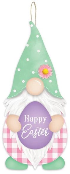 a happy easter gnome ornament hanging on a wall with a pink flower in the center