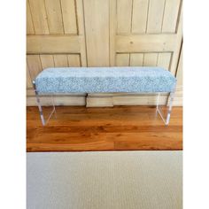 a bench sitting on top of a hard wood floor