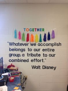 there is a sign on the wall that says, together we accomplish belongs to our entire group a tribute to our combined effort walt