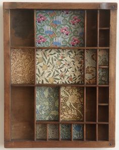 a wooden shelf with many different designs on it