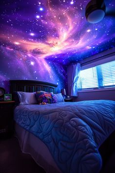 a bed room with a neatly made bed and stars painted on the ceiling