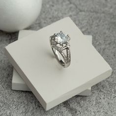 A wonderful ring to accompany you on your special days. Also great as a gift to your loved ones. We wrap it beautifully as a gift wrap for you. 💎 9 mm cubic zircone, 6 pieces of small baguette zircon,  it is decorated with 6 round zircon stones and 24 small zircon stones 💎 Big Zircon Silver Ring it will add sparkle to your glow. 💎 It is decorated with one large zircon stone with a hexagon shape of 9 mm in size and small zircon stones around it. 💎 It is specially made according to your finger Gift Diamond Ring With Prong Setting Open Design, Gift Diamond Open Ring With Prong Setting, Diamond Open Ring With Prong Setting As Gift, Dazzling Diamond White Sapphire Ring Gift, Diamond Crystal Promise Ring With Gemstone, Gift Diamond White Birthstone Ring With Prong Setting, White Diamond Ring As Gift, Diamond White Diamond Ring For Promise Occasion, Diamond White Birthstone Ring Round Cut For Gift