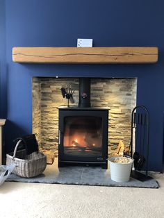 a living room with a fireplace and blue walls