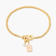 This Molly Enamel Charm Bracelet is the perfect bracelet to create your charm story! It comes with a blush initial enamel charm and a sparkly cz crystal charm, and the hinge closure. Available in 14k gold plated brass Avery Bracelet: Size: 6" bead bracelet, hinge closure measures 1/2", 4mm beads Molly Initial Enamel Charm: 3/8"x1/4" enamel filled charm, hinge closure Leia Charm: 3mm round cz bezel, hinge closure Protected with an anti-tarnish barrier With customization this item is FINAL SALE NO Tennis Jewelry, Modern Jewellery Design, Slide Bracelet, Gold Charm Bracelet, Crystal Charm, Enamel Charms, Monogram Initials, Birthstone Jewelry, Turquoise Jewelry