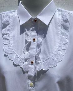 "Authentic Spanish Lace Shirt from Andalucia in Southern Spain  Girl's Vintage  Dress Shirt/Blouse  Formal Equestrian Lace Blouse Age 8-10 Approx Spanish size 32 Measurements: PLEASE CHECK OR IT MIGHT NOT FIT! Chest 34\"(86.5cm).  Sh to sh 15\"(38cm) Collar 12\"(15cm).  Length from nape to hem 23.5\"(60cm) Sleeves from sh to cuff 19.5\"(49.5cm).  P to cuff 16\"(40.5cm) Pretty White Cotton Shirt with Broderie Anglaise Lace Wide Pleated Front with Lace Frill surround 3 Sparkling Ruby Rhinestone Buttons in Gold Tone Clasps All the others are regular white shirt buttons  Excellent Condition Ref: FB9/KSH1 Shipping I usually send with Economy International Post  Delivery time 2-3 weeks approx depending on destination" Spanish Lace, White Lace Shirt, Vintage Shirt Dress, Vintage Girls Dresses, Southern Spain, Girls Blouse, Lace Shirt, Lace Blouse, Vintage Dress