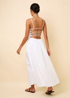 Our bestselling Delta Midi Dress is back in Optic White. The smocked bodice with a relaxed skirt offers a flattering fit for all figures. This silhouette offers adjustable straps, pockets, and an exposed back with elastic straps for optimal fit. Brunch Dresses With Lace-up And Strappy Back, Spring Midi-length Backless Dress With Lace-up Back, Spring Midi Length Lace-up Backless Dress, Spring Midi Backless Dress With Lace-up Back, Brunch Backless Dress With Spaghetti Straps And Lace-up Back, Backless Midi Dress With Adjustable Straps For Brunch, Fitted Bodice Sundress With Tie Back, Chic Strappy Midi Dress With Adjustable Straps, Backless Sundress With Smocked Strappy Back