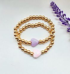 These super cute 6mm gold plated bracelets are a great gift for girls! Choose from a pink or purple sparkle glitter heart! This bracelet is a great gift for a birthday or Valentines day. How to order Choose a heart color Choose a size for bracelet Add to cart and purchase Handmade with love and care Valentines Bracelets, Purple Sparkle, Glitter Hearts, Gift For Girls, Sparkles Glitter, Gold Plated Bracelets, Heart Bracelet, Bracelet Gift, Gifts For Girls