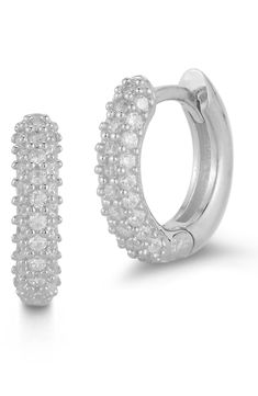 Pavé CZ stones adorn lustrous gold vermeil or sterling silver hoop earrings for elegant sparkle. 0.5" hoop diameter Hinged post back Sterling silver or gold plated sterling silver/cubic zirconia Made in Turkey Formal Huggie Earrings With Sparkling Stones, White Gold Hoop Jewelry With Sparkling Stones, Formal Sparkling Stone Huggie Earrings, Sterling Silver Huggie Jewelry With Pave Setting, Fine Jewelry Hoop Earrings With Sparkling Stones For Anniversary, Fine Jewelry White Gold Hoop Earrings With Sparkling Stones, Anniversary Hoop Earrings With Sparkling Stones, Cubic Zirconia Pave Setting Huggie Earrings, Pave Setting Cubic Zirconia Huggie Earrings