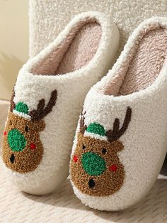 Product Description Snuggle up in festive cheer with these charming Christmas slippers. With nine delightful styles, each pair boasts a unique holiday character, from a jolly Santa and a prancing reindeer to a crafty fox and a sweet gingerbread man. These slippers are made with a soft, plush material to keep your toes toasty, while the sturdy, non-slip soles ensure a safe and comfy stride. Perfect for a cozy night in or as a heartwarming gift, they’re sure to spread joy and warmth this holiday season. Winter Products, Holiday Slippers, Fluffy Cushions, Christmas Slippers, Christmas Shoes, Christmas And Winter, Bedroom Slippers, Winter Slippers, Fuzzy Slippers