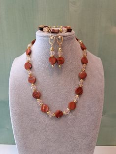 This jewelry set is very simple, but elegant. The necklace is abt. 45 cm long, matching earrings abt. 5 cm, and the bracelet is adjustable from 17 to 22 cm. For this realization, I used red agate and crystal beads. It is unique and unusual, but still a delicate composition. This set can be a perfect gift for someone you love or for yourself for a special occasion. General note: Please, remember that sometimes gemstones and pearls can have an uneven surface since they are natural. Set Necklace, Agate Jewelry, Elegant Red, Red Agate, Necklace Earrings, Matching Earrings, Hungary, Crystal Beads, Jewelry Set